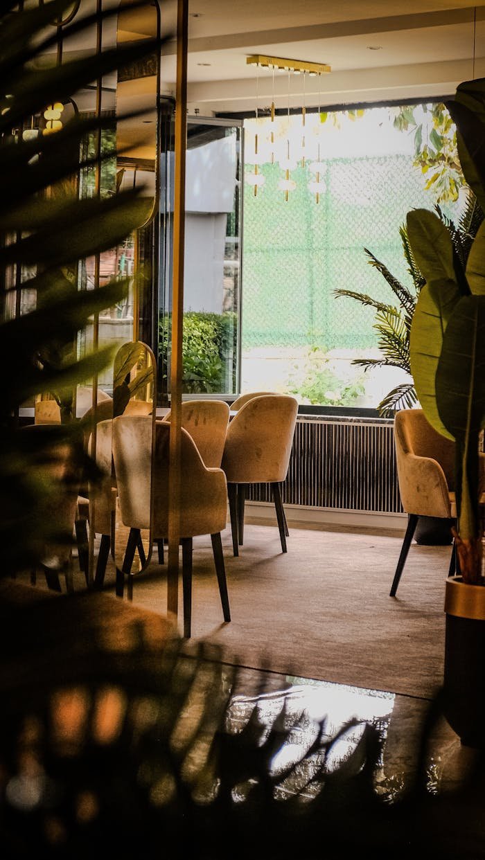 Warm, inviting indoor seating area in a modern cafe with stylish decor.